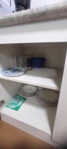 a shelf with two plates and a bowl on it at Cabaña lomas de chaica in Puerto Montt