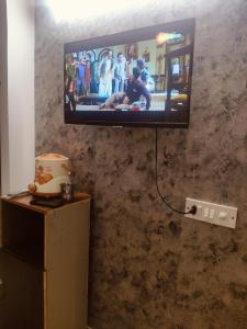 a flat screen tv hanging on a wall at StudeXO in Ghaziabad