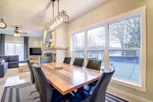a dining room with a wooden table and chairs at Lake Joseph Retreat -Waterfront and Hot tub in Saint-Pierre-Baptiste