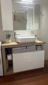 a bathroom vanity with a sink and a mirror at Ampio appartamento centro storico - Famiglie in Montalto Pavese +34 photos