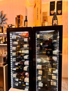 a refrigerator filled with lots of bottles of wine at B&B DonnaLina in Vignacastrisi