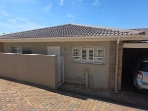a house with a car parked in front of it at Heuwels Haven in Mossel Bay