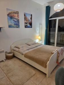 a bedroom with a large bed in a room at Igalo in Igalo