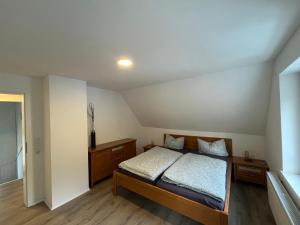 a bedroom with a bed in a room at Villa Maria in Westerburg