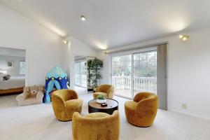 a living room with chairs and a table and a bed at 'Whispering Oaks Estate' w/ Pool & View in Murphys in Vallecito +29 photos