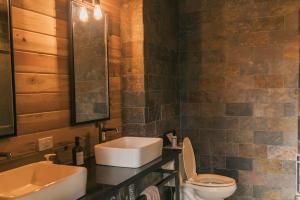 a bathroom with a sink and a toilet at Campfire Ranch Private Cabin, Meals Included in Bergen Park