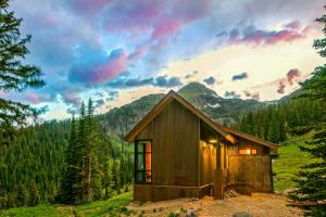 a small cabin in the middle of a mountain at Campfire Ranch Private Cabin, Meals Included in Bergen Park +17 photos