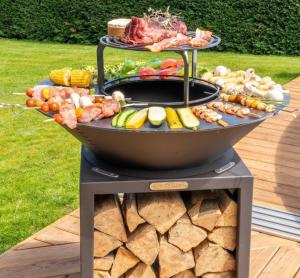 a grill with a bunch of different types of food on it at VILLA du VERNET avec JACUZZI in Vernet