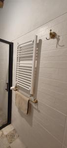 a bathroom with a towel rack and a window at Casa Doval in Cortelazor +40 photos