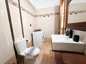 a bathroom with a toilet and a sink at Thalori Home Georgioupolis in Georgioupolis +19 photos