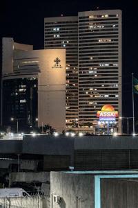 a view of a city at night with buildings at Boulevard Plaza Flat Mirante Apto 201 in Campina Grande