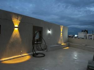 a room with lights on the side of a building at Sea View 1 Bedroom Apartment with 100m Terrace in Sousse