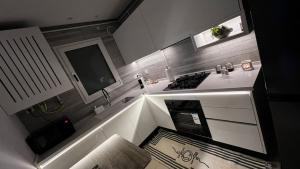 an overhead view of a kitchen with a stove at chez-moi sfax in Sfax