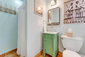 a bathroom with a green toilet and a sink at BOOTLEGGER BAY @ Speakeasy Inn Key West! in Key West