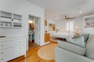 a living room with a couch and a bedroom at AFTER HOURS @ Speakeasy Inn Key West! in Key West