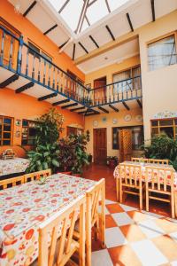 a large room with a table and chairs at Hotel Posada del Angel in Cuenca