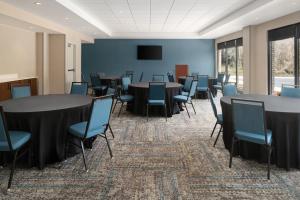 a conference room with tables and chairs and a tv at Hampton Inn Spring Lake Fayetteville in Spring Lake +51 photos