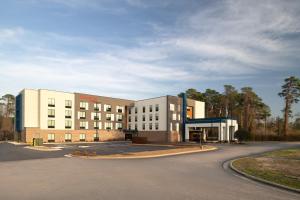 a hospital building with a road in front of it at Hampton Inn Spring Lake Fayetteville in Spring Lake