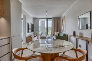 a living room with a table with a wine glass on it at Caica Executives at Ellipse 4108 in Midrand