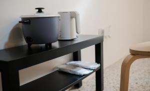 a black table with a mixer on top of it at Casita Benito Loft D in Sangley Point Naval Station +2 photos