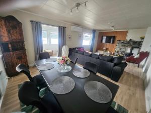 a living room with a table and a couch at HOL Familie Hous in Hol +10 photos