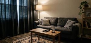 a living room with a couch and a coffee table at Kule Rezidance Hotel in Seyhan