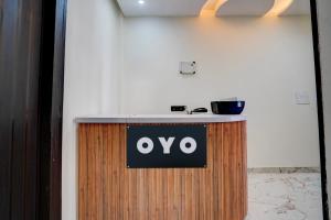 a sign that says oxy on a counter in a room at Hotel O J K Galaxy Hotel in Juhi Bari