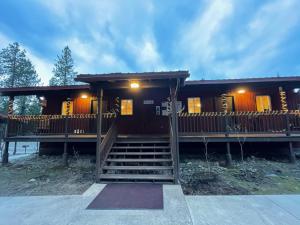 a house with a staircase in front of it at Bear creek resort in Thompson Falls