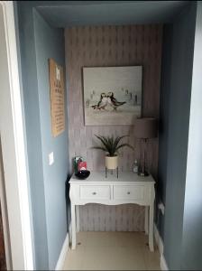 a room with a white table and a picture on the wall at Blue Haven in Upper Ballycotteen