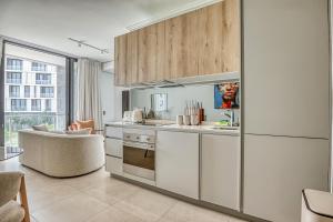 a kitchen with white cabinets and a counter top at Caica Executives at Ellipse 4103 in Midrand
