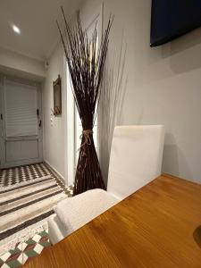 a vase sitting on a table in a room at GaritsaEegant in Anemómylos
