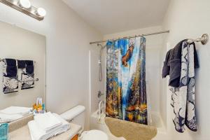 a bathroom with a shower with a shower curtain at 1 Mi to Boat Launch! Lake-View Chiloquin Retreat in Chiloquin +17 photos