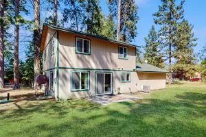 a house that is sitting in the grass at 1 Mi to Boat Launch! Lake-View Chiloquin Retreat in Chiloquin