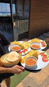 a table with a bunch of food on it at Ghazala hotel dahab in Dahab