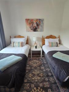 two beds sitting next to each other in a room at The Bungalow Killybegs in Killybegs