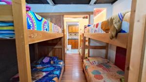 a group of bunk beds in a room at Hostal SAVEVA in Medellín