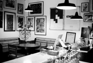 a black and white photo of a restaurant with a table at Locanda Laudomia in Manciano