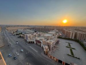 an aerial view of a city at sunset at Cabilyt Cairo Luxiury Apartment in Obour
