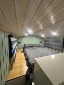 a bedroom with a bed and a tv in it at Goga Otel in Sarıyer
