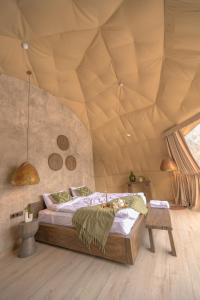 a bedroom with a bed in a tent at Anima Resort Aghveran - Forest Retreat in Aghveran