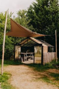 a tent is set up in a field at Glamping Pod in de natuur Eigen badkamer in Oudehornstercompagnie +9 photos