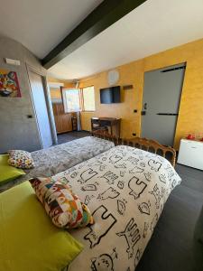 a bedroom with a bed with drawings on it at Camera di Molly in Leivi