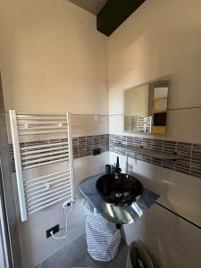 a bathroom with a sink and a mirror at Camera di Molly in Leivi