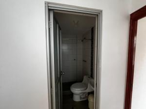a bathroom with a toilet and a shower at Habitación Privada Centro in Ayacucho