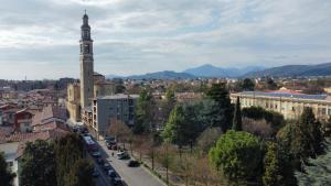 a view of a city with a clock tower at MR Suites Bergamo in Seriate