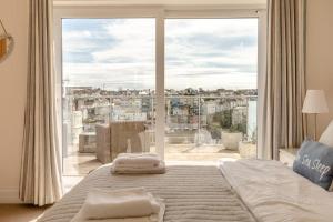 a bedroom with a bed and a large window at 3 Bed in Brixham oc-57892 in Brixham