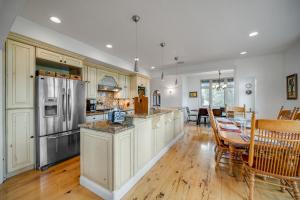 a kitchen with white cabinets and a table and chairs at Fun w/ Family! Mtn-View Gem w/ Deck in Driggs in Driggs