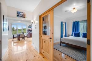 a bedroom with a bed and a dining room at Fun w/ Family! Mtn-View Gem w/ Deck in Driggs in Driggs
