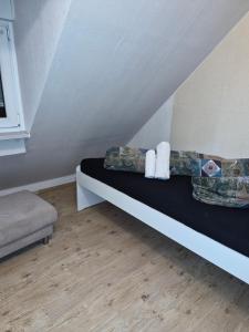a room with a bed with towels on it at Holiday Rhein 5 in Boppard