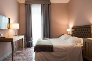 Postel nebo postele na pokoji v ubytování Palazzo Dei Mercanti - Dimora & Spa